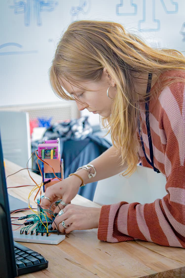 Maile Campbell working on electronics