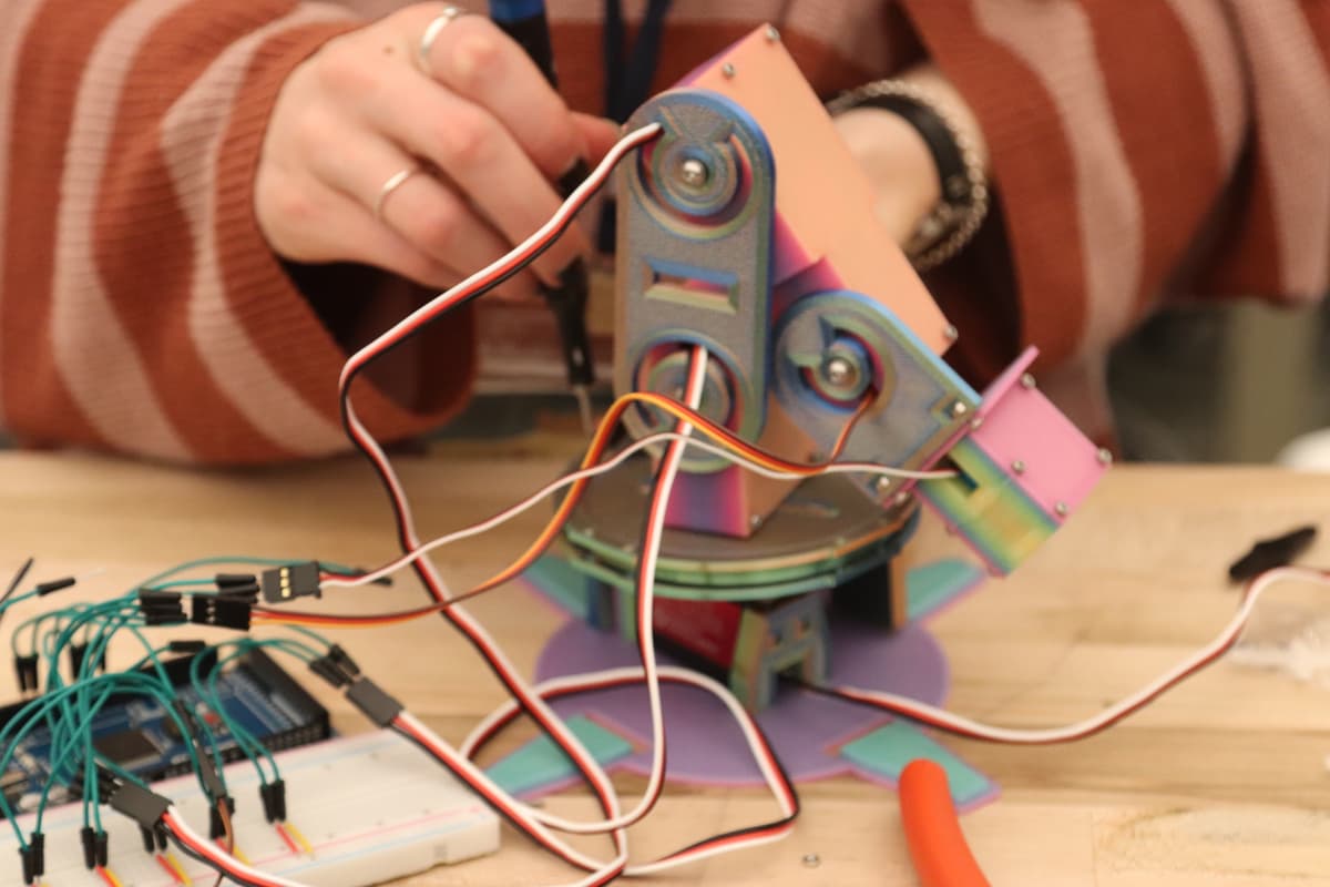 Assembling the robotic arm with servo motors and wiring