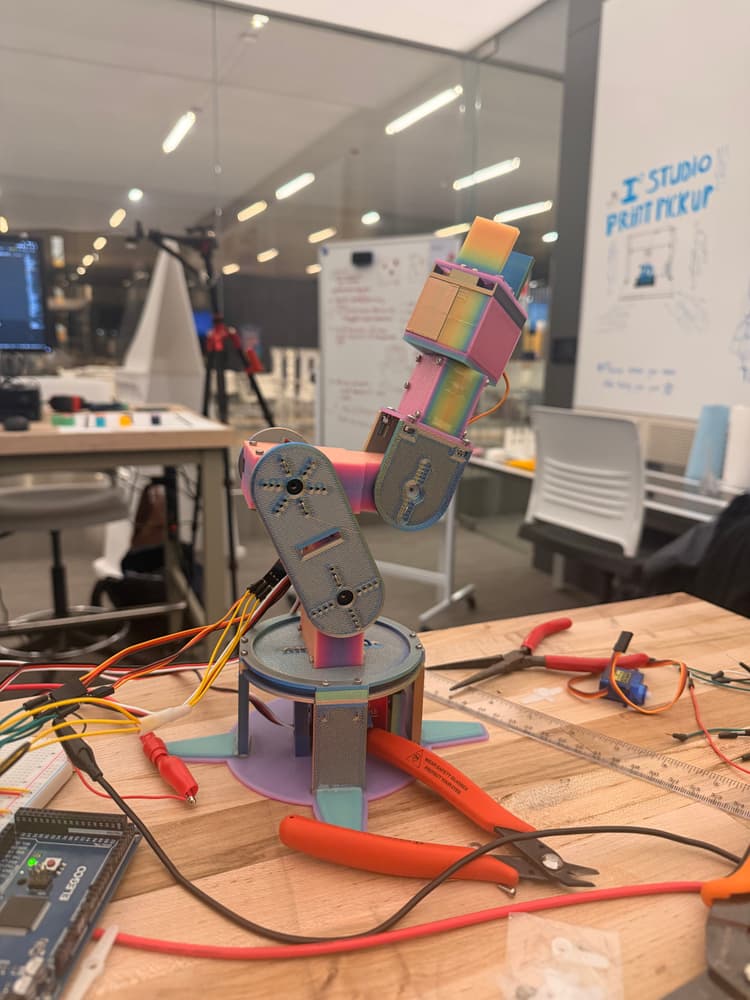 Completed 6-DOF robotic arm picking up a cube